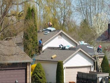 Lake Zurich, IL Re-roof with architectural shingles. New gutters with oversize downspout. Brand new insulated garage door and fireproof side door.