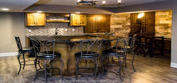 Basement remodel with kitchen, wetbar, bathroom, living area and bedrooms This basement was completely unfinished. The homeowner had us add a kitchen, 