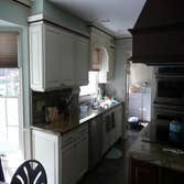 KITCHEN #3 This kitchen remodel included removal of a bearing wall which opened the dining room to the kitchen , separated by a bank of cabinets. This
