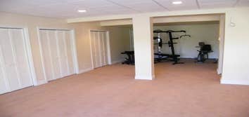 Beveled Edge Renovations Basement Remodel BER designed and built a 2600 basement to include a fitness area, recreation area and additional bedrooms.