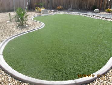 Artificial Turf Installation Before and after pictures for a synthetic turf system.