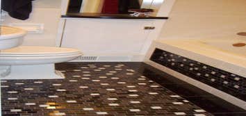 Laundry Room to Bathroom Conversion Hand made mosaic tile floor,tub face, shower walls, custom built in cabinets and more