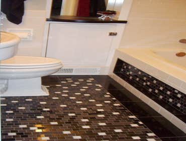 Laundry Room to Bathroom Conversion Hand made mosaic tile floor,tub face, shower walls, custom built in cabinets and more