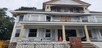 Photos by Triple Infinity LLC #2 The deck was redone from it's original 1889 frame. The home owner's built a concrete sloped deck on the bottom with wo