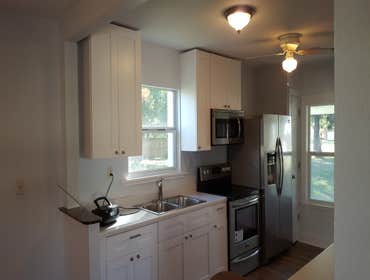 Photos by Demo & Renovation Services, LLC #1 Complete remodel to one bathroom and kitchen. Repaired drywall throughout house. New trim and doors. Pa