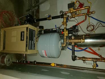 Photos by Dimatic Control LLC #4 Furnish and Install Hot water baseboard boiler and radiators with three zones for home.