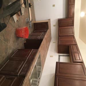 Sims Foster Home New Kitchen Was asked to install a new Kitchen in a new construction. There were a total of 33 cabinets installed and a Custom...