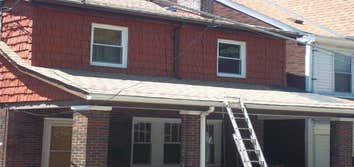 Project photos from Herman Roofing Roof Before & After Shakewood Lifetime Dimensional Shingles