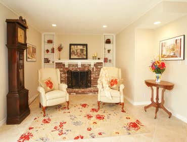 Custom Kitchen/Sitting room Originally this kitchen and sitting room had outdated builders-grade tile countertops, stock cabinetry, old appliances, lam