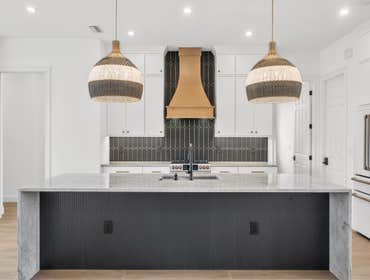 Via Del Santi Residence - Waterfront Modern Transformation This waterfront residence in Venice, Florida underwent a full interior remodel focused on re