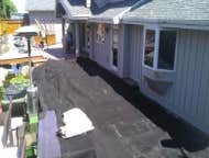 Photo(s) from Moon Painting Service And Finishes Catching paint chips over high-end landscaping