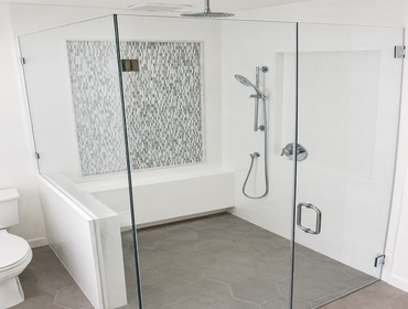 Modern Bathroom Remodel with Custom Vanity & Frameless Glass Shower This bathroom remodel upgraded the space with a modern frameless glass shower enclo