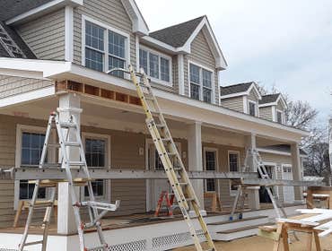 Photos by Better Home Improvement #1 New construction, vinyl cedar impressions, PVC/azek corners and fascia. Completely maintenance free . Absolutely 