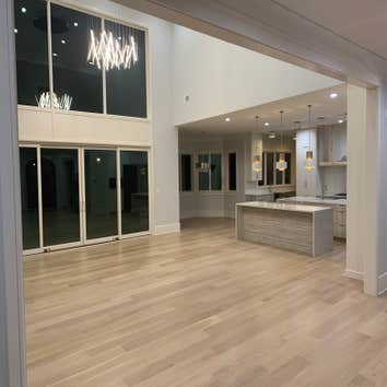 Photos by General Hardwood Flooring Inc #1 White oak 5”x3/4 installed, sanded and refinished with custom stain color