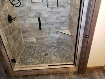 Photos by North Country Construction Inc #1 We built this gorgeous 5,000 SF house for a client in the powderhorn. It has a attached 3 car garage on a n