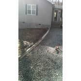 Driveway This driveway was widened and made more functional with a retaining wall and concrete pavers.