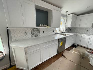 Photos by Smilenow Landscaping LLC #1 In this project, we installed custom backsplash as well as countertop installation.