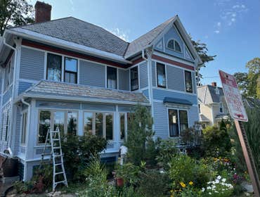 Amherst Victorian Project Exterior Restorative Painting on old & new sections of house. Interior painting on new and old sections, refinish grand stair
