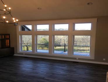 Photos by Thomas Elliott #1 2100 sf home with partially finished pre-cast concrete basement. This home has wood flooring, custom woodwork, tile and cab