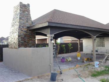 PROJECT FROM ARJONA REMODELING Outdoor palapa includes a chimney made of stone and stucco. The chimney also has a sink on one side and on the other the