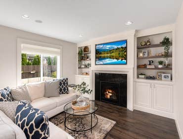 Photos by Oak & Stone Inc #2 New laminate flooring and tile fireplace.