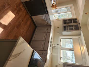 Photos by Mph Construction Company #9 Kitchen flood damage, cabinet and floor removal. Kitchen update with granite.