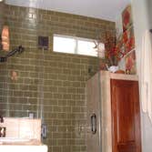 Belmont Shore Bathroom This project was a small bathroom in Belmont Shore. We turned the tub into a shower and moved the shower head to the opposite wa