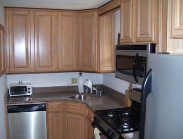 Tracy Wholehouse Renovation This project was a total gut job all had to be removed,we installed, new bathroom , kitchen, wood floors and deck.