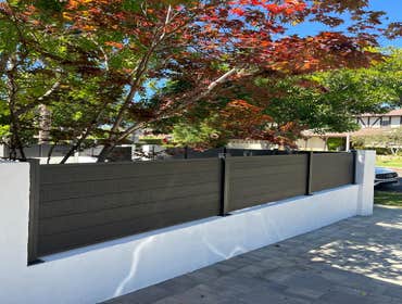 Photos by Prime Builders & Experts Inc #5 Front yard remodel with custom fencing and masonry wall with pavers and aluminum fencing.