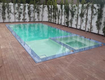 Photos by M.Y Contractors Inc #13 Zero edge pool with Trex decking.