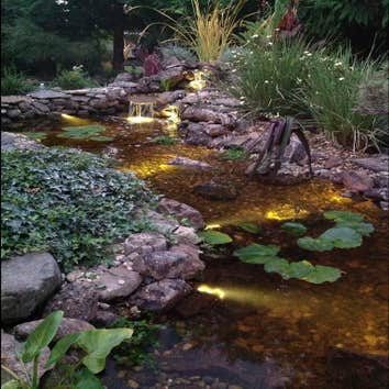 Anthony & Elizabeth This was rebuilding a waterfall and fixing a leaking pond made of cement. We added natural gravel, LED underwater lights and a new 