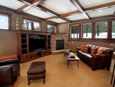 Lockridge Residence This new Transitional Custom Home was built on the owners heavily wooded lot and designed to maintain the woodsy feel while taking 