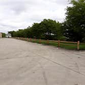 Photos by Weise Choice Construction #1 Cedar split rail fence added for aesthetic purposes and a deterrent for trucks driving in the grass.