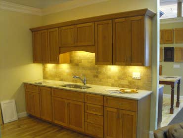 Showroom Photos These displays are in our beautiful showroom in Medfield, MA. They are all wood custom cabinets made to our exacting specifications wi