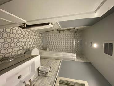 Photos by Cascella & Sons Construction Corp #2 Complete Remodel of Guest Bathroom - Carrera Marble Custom Tile Inlays, Mosaics, Recessed Soap & Shampoo