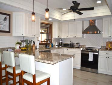 Luxury Farmhouse Kitchen Remodel of this beautiful large kitchen from a dated 80's kitchen into a modern yet classic kitchen for the whole family to en