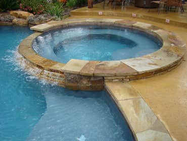 Crabtrey Project The complete package! This backyard was designed with family entertainment in mind. An oversized spa and a large sun shelf were desig