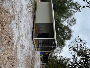 Photos by Big Water Custom Homes & Realty Inc Insulated Panel Cabin with Screen Porch