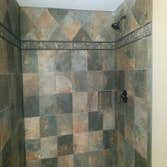 Shower tile with hidden niche