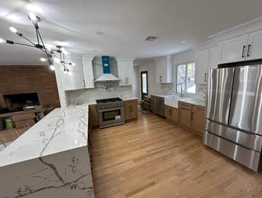 Photos by Alfredos Construction LLC #1 We did a complete rebuild on this property from floor bathrooms,kitchen,siding,HVAC et