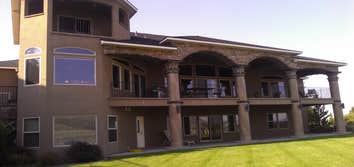 Photo(s) from Moon Painting Service And Finishes Catching paint chips over high-end landscaping
