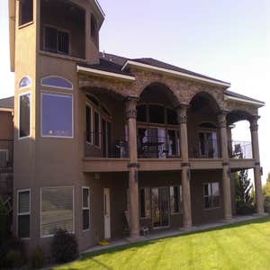 Photo(s) from Moon Painting Service And Finishes Catching paint chips over high-end landscaping