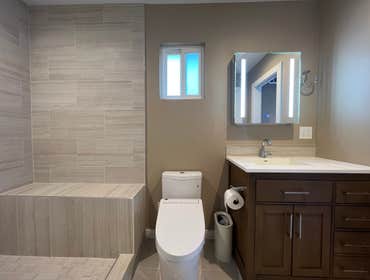 Campbell Bathroom and Laundry Room Remodel Complete master bathroom remodel with load bearing wall removal, tankless water heater installation, laundry