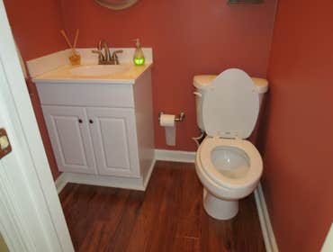 A family's living room and kitchen installed with laminate This project started out with us removing the old existing carpet in the living room and old