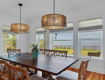 Bells River Residence Nestled in the serene Waterman’s Bluff in Yulee, FL, this exquisite home offers 3,046 sq ft of living space, expanding to a total