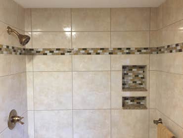 The Buckingham This was a floor to ceiling renovation that included; new countertops, beautiful Kemper cabinets, large format wall and floor tile, new 