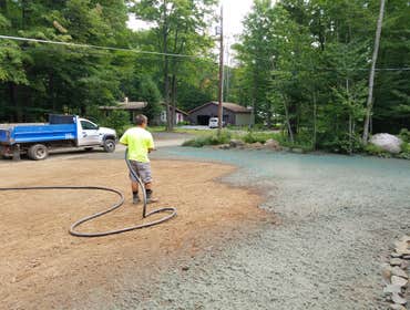 Spraying hydroseed material