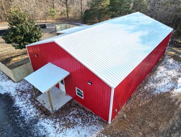 Silver Lining Kennels New 40’x60’ boarding facility. Metal interior walls and ceiling in the kennel area. Office area and closets are drywall with 1x s