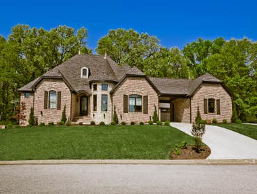 Photos by Celtic Construction, Inc #13 3850 sq. ft. home with turret, antique brick, and portico.