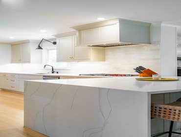 Photos by Albrecht, LLC #1 Through strategic space planning, thoughtful material selections, and custom craftsmanship, this first-floor renovation tran
